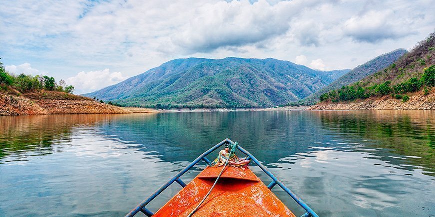 Boat sailing on the Mae Ping River in Chiang Mai