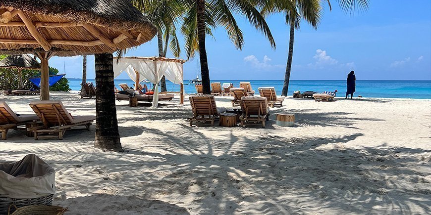 Tropical beach and beach chairs in Zanzibar