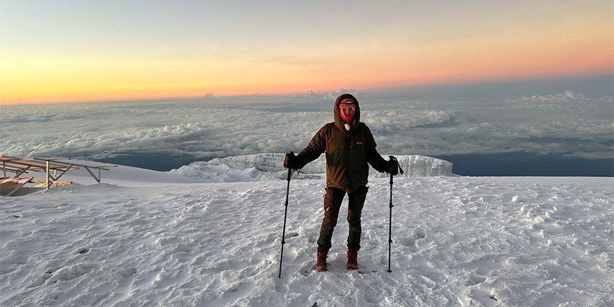 Catriona on the top of Kilimanjaro during sunrise