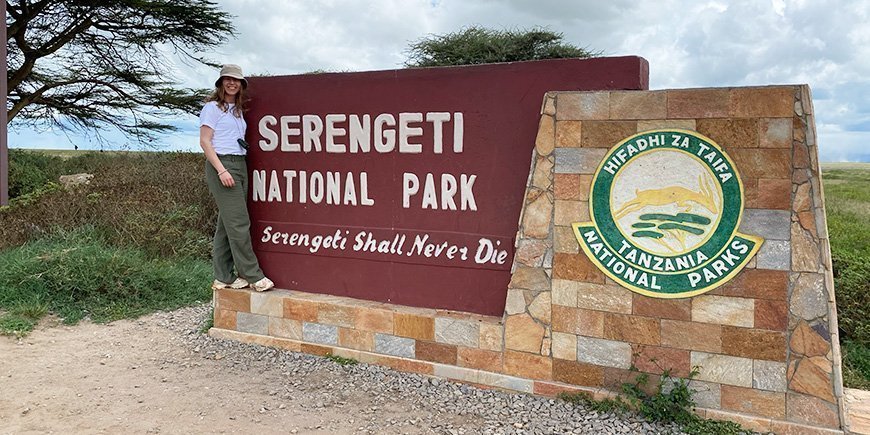 Inger stands at the entrance to Serengeti National Park in Tanzania