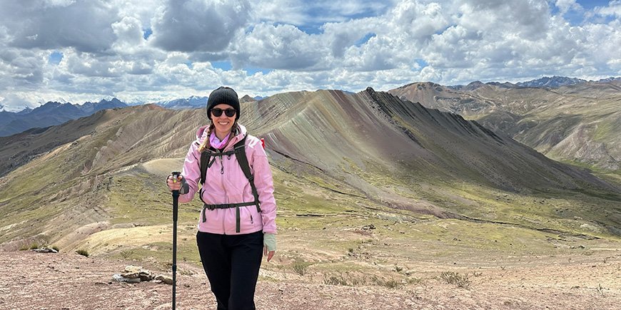 Iida with a view of Rainbow Mountain in Peru