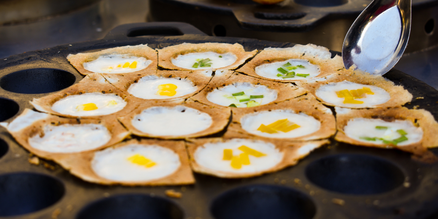 Khanom Krok cooked in a pan