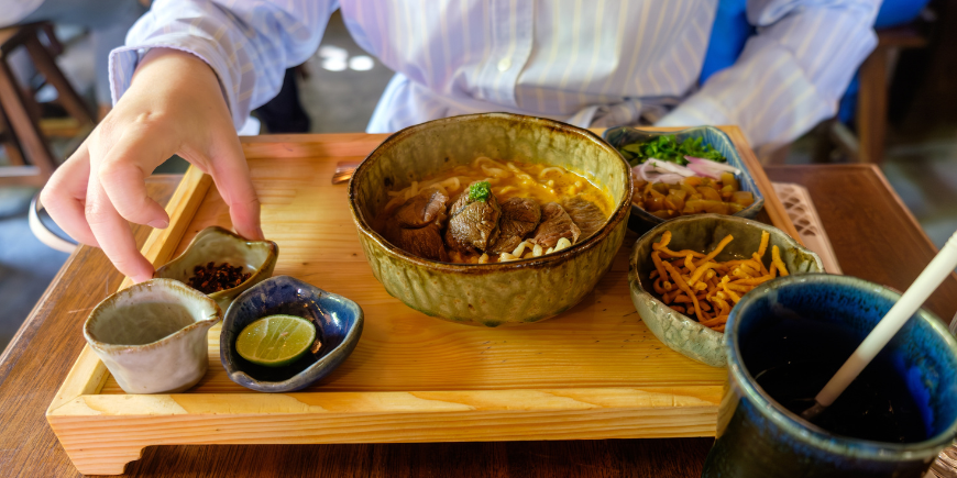 Person eating Khao Soi 