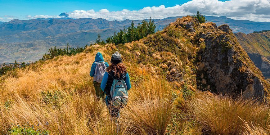 Two women walking in the mountains near Quito.