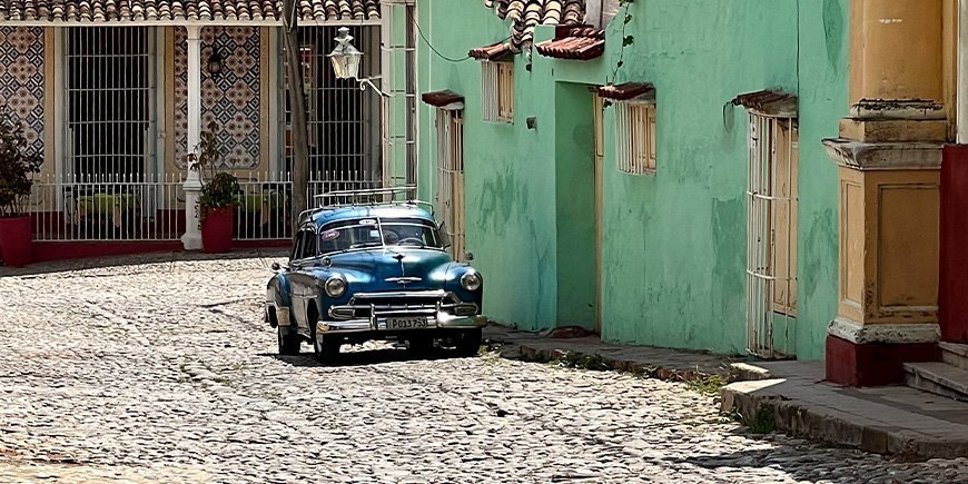 Old American car in the cobbled streets of Trinidad