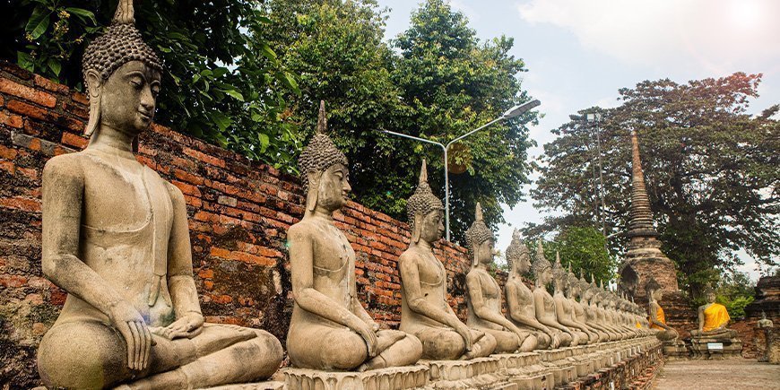 Statues lined up at Wat Yai Chai Mongkhon in Ayutthaya, Thailand