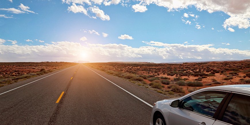 Car travelling on the right side of the road in Nevada, USA