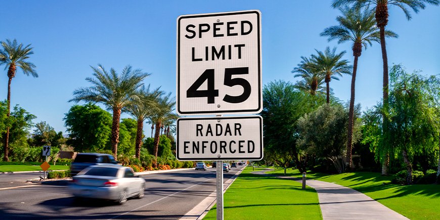 Road sign with speed limit on the road in California