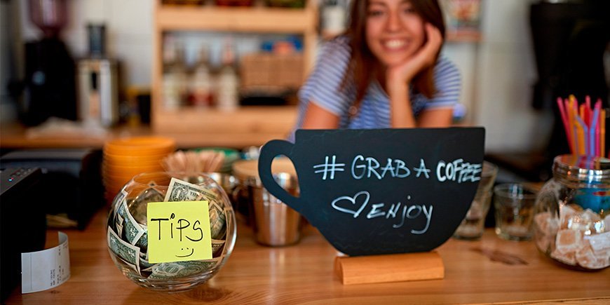 Tipping glass in a café