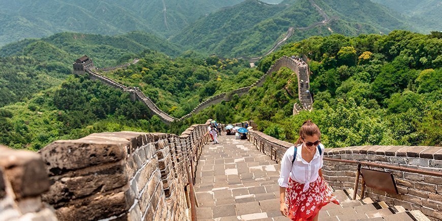 Woman walking on the Great Wall of China in Beijing, China