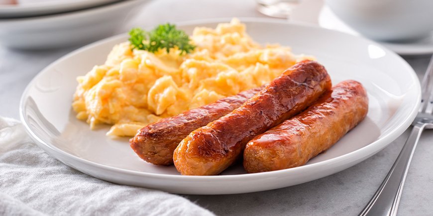 Breakfast sausages with eggs