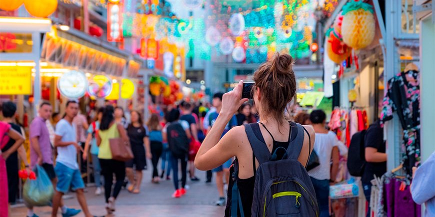 Women photographing in Chinatown in Singapore