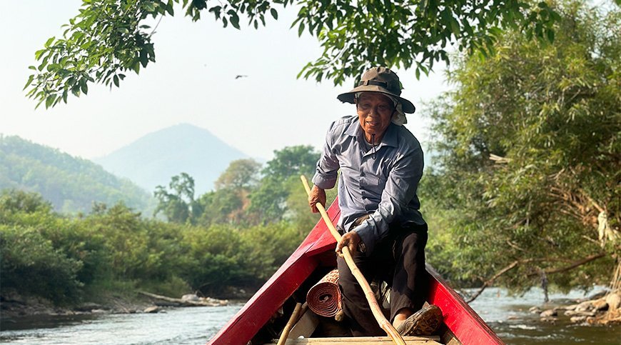 Local man on a boat in northern Thailand