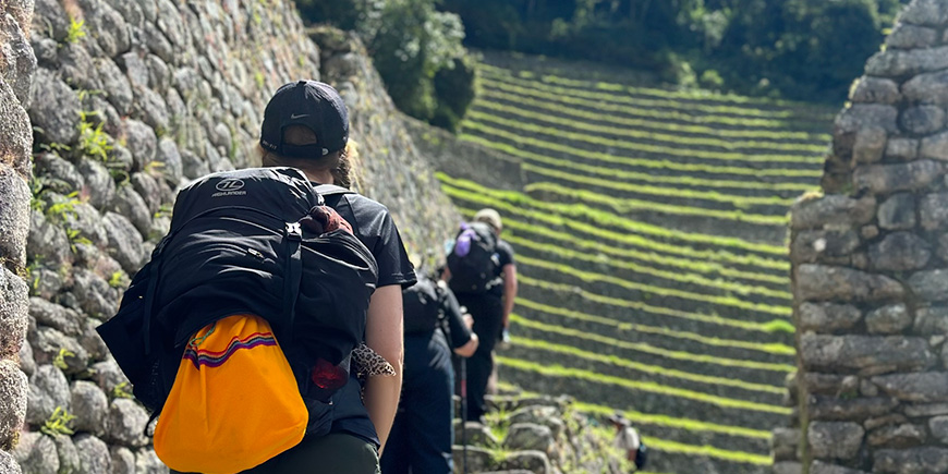 Women approach Machu Picchu on the Inca Trail in Peru