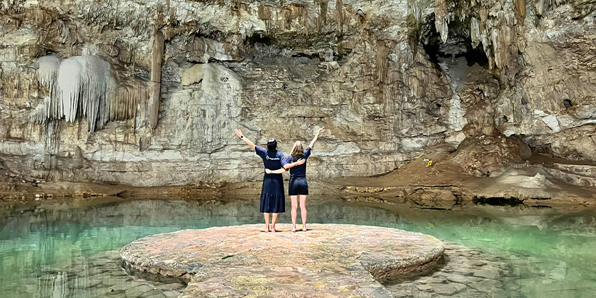 2 women standing in the Suytun cenote in Yucatán, Mexico