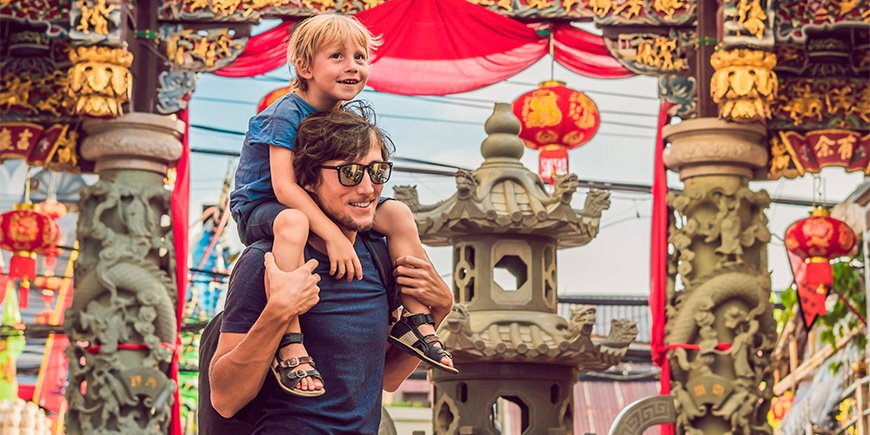 Father and son in Chinatown in Phuket, Thailand