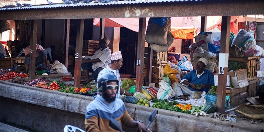 Men selling goods at the market in Stone Town