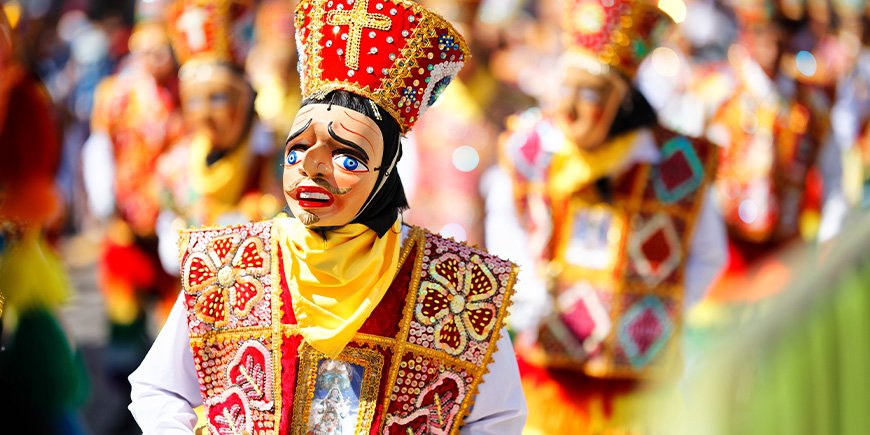 Person in costume at the Inti Raymi festival in Cusco, Peru