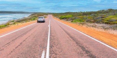 Car travelling on the Great Ocean Road in Western Australia